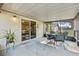 Enclosed patio featuring a tiled floor, screened windows, and a view of the backyard, creating a serene retreat at 4219 Sunny Land Dr, Lakeland, FL 33813