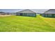 Lush backyard featuring healthy green grass, offering ample space for recreation at 4300 Juliana Lake Dr, Auburndale, FL 33823