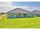 Beautiful backyard featuring well-maintained grass, and an inviting outdoor space at 4300 Juliana Lake Dr, Auburndale, FL 33823