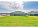 Spacious backyard with green lawn, perfect for outdoor activities and relaxation at 4300 Juliana Lake Dr, Auburndale, FL 33823