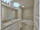 Bathroom with double sink vanity, tile surround tub and shower at 4300 Juliana Lake Dr, Auburndale, FL 33823