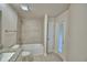 Bright bathroom featuring a white tub with shower and a granite countertop vanity at 4300 Juliana Lake Dr, Auburndale, FL 33823