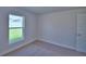 Cozy bedroom with natural light, carpeted floor, and white trim at 4300 Juliana Lake Dr, Auburndale, FL 33823