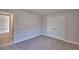 Bedroom with carpet flooring, a double door closet and views to hallway at 4300 Juliana Lake Dr, Auburndale, FL 33823