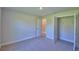 Comfortable carpeted bedroom with a closet and hallway view at 4300 Juliana Lake Dr, Auburndale, FL 33823