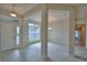 Bright foyer offering open layout to living and dining spaces with tile floors at 4300 Juliana Lake Dr, Auburndale, FL 33823