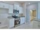Modern kitchen features stainless steel appliances and granite countertops at 4300 Juliana Lake Dr, Auburndale, FL 33823