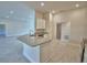 Bright kitchen area with stone countertops and stainless steel appliances at 4300 Juliana Lake Dr, Auburndale, FL 33823