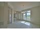 Bright, open-concept living room with lots of natural light and tiled floor at 4300 Juliana Lake Dr, Auburndale, FL 33823