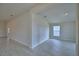Spacious living area showcasing neutral walls and tile flooring at 4300 Juliana Lake Dr, Auburndale, FL 33823