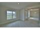 Inviting living room with natural light, open floor plan, and lake views at 4300 Juliana Lake Dr, Auburndale, FL 33823