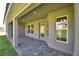 Covered patio area showcases brick flooring and stylish design elements at 4300 Juliana Lake Dr, Auburndale, FL 33823