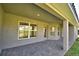 Covered patio with brick flooring, offering a relaxing outdoor space at 4300 Juliana Lake Dr, Auburndale, FL 33823
