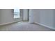 Bedroom featuring neutral carpet, base trim and natural light at 4449 Juliana Lake Dr, Auburndale, FL 33823