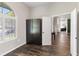 Comfortable bedroom with hardwood floors and a view of the living space at 4642 Highlands Place Dr, Lakeland, FL 33813