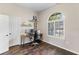 Bright bedroom with wood floors, a large window, and a functional work area at 4642 Highlands Place Dr, Lakeland, FL 33813