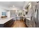 A spacious kitchen features a large island, stainless steel appliances, and modern gray cabinets at 4642 Highlands Place Dr, Lakeland, FL 33813