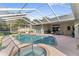 Relaxing pool area features a screened-in enclosure and outdoor seating at 4642 Highlands Place Dr, Lakeland, FL 33813