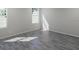 Bright bedroom featuring hardwood floors and large windows with natural light at 470 Windy Willow Way, St Cloud, FL 34771