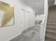 A well-lit entryway featuring a staircase and stylish decor at 470 Windy Willow Way, St Cloud, FL 34771