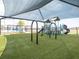 Shaded community playground with swings, slides, and ample green space for children to enjoy at 485 Silverbell Trl, St Cloud, FL 34771