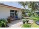 Cozy back patio featuring outdoor furniture, potted plants, and serene views of the surrounding landscape at 5026 N Socrum Loop Rd, Lakeland, FL 33809