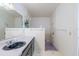 Bathroom featuring dual shower heads, sleek countertops, and contemporary fixtures for a modern feel at 5026 N Socrum Loop Rd, Lakeland, FL 33809