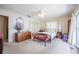 Inviting bedroom boasts plush carpeting, ceiling fan, and access to an outdoor patio at 5026 N Socrum Loop Rd, Lakeland, FL 33809
