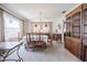 Bright dining room featuring a chandelier, and a large wooden cabinet at 5026 N Socrum Loop Rd, Lakeland, FL 33809