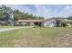 Attractive single-story home with a well-maintained front yard and mature landscaping at 5026 N Socrum Loop Rd, Lakeland, FL 33809
