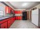 This retro kitchen features colorful cabinets, tiled backsplash, stainless appliances, and ample counter space at 5026 N Socrum Loop Rd, Lakeland, FL 33809