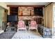 Cozy living room with exposed-brick fireplace, built-ins, and a comfortable seating arrangement at 5026 N Socrum Loop Rd, Lakeland, FL 33809