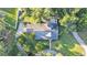 Overhead view of the house showcasing the roof, driveway, and landscaping at 5108 Waterwood Dr, Bartow, FL 33830