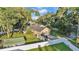 Aerial view of the house showing the expansive lot with mature trees and fencing for added privacy at 5108 Waterwood Dr, Bartow, FL 33830