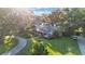 Charming single-Gathering home surrounded by mature trees and lush landscaping, viewed from above at 5108 Waterwood Dr, Bartow, FL 33830