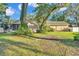 Spacious backyard with patio, mature trees, lush lawn and shed at 5108 Waterwood Dr, Bartow, FL 33830