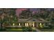 Single-story home with a covered front porch, manicured landscaping, and mature trees at 5108 Waterwood Dr, Bartow, FL 33830