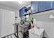 Laundry room with washer, dryer, utility sink, and storage cabinets at 5108 Waterwood Dr, Bartow, FL 33830