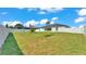 Spacious backyard features a well-maintained lawn and privacy fence, ideal for outdoor activities and relaxation at 5458 Oakford Dr, Lakeland, FL 33812