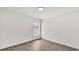 Empty bedroom with a window bringing in natural light and wood-look flooring at 5458 Oakford Dr, Lakeland, FL 33812