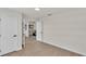 Bedroom with neutral colors, featuring wood floors and access to other rooms in the house at 5458 Oakford Dr, Lakeland, FL 33812