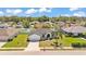 Charming single-story home with manicured lawn, mature palm tree, and inviting double-door entrance at 5458 Oakford Dr, Lakeland, FL 33812
