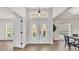 Welcoming foyer with elegant double doors, wood floors, and plenty of natural light at 5458 Oakford Dr, Lakeland, FL 33812