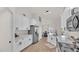 Modern kitchen with white cabinetry, stainless steel appliances, and an open concept layout at 5458 Oakford Dr, Lakeland, FL 33812