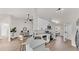 Bright and airy kitchen with white cabinets, quartz countertops, and stainless steel appliances at 5458 Oakford Dr, Lakeland, FL 33812