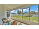 Relaxing screened lanai with a view of the backyard and a comfortable seating area at 5458 Oakford Dr, Lakeland, FL 33812
