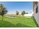 Expansive backyard with beautiful water view, lush lawn, and privacy fence at 606 Fairview Ave # 244, Haines City, FL 33844