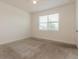 Well-lit room with neutral walls and carpet, offering a blank canvas for personalization at 606 Fairview Ave # 244, Haines City, FL 33844