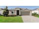 Inviting single-story home featuring a well-maintained lawn and a neutral color palette at 606 Fairview Ave # 244, Haines City, FL 33844