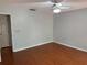 Bedroom features hardwood floors, ceiling fan, and neutral wall color at 6116 Sweet Gum Run, Bartow, FL 33830
